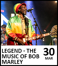 Image of the tribute performer singing on stage, accompanied by a live band. Image reads: Legend - The Music of Bob Marley, 30 Mar
