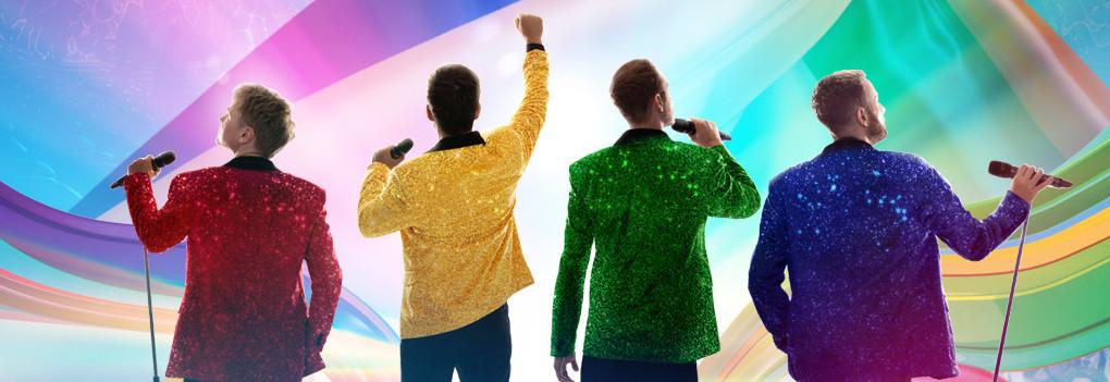 4 dreamcoat stars facing away from the camera wearing different coloured sparkly jackets